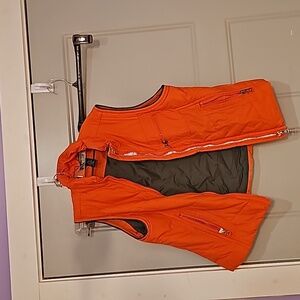 Orange puffer vest, size large,  with front zipper pocket